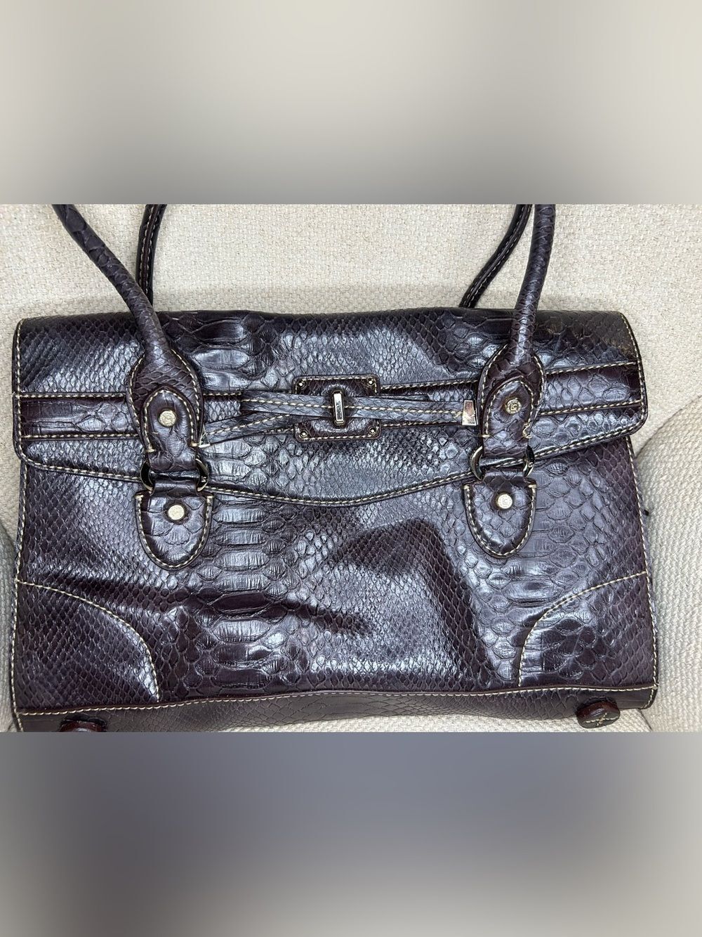 Liz Claiborne satchel featuring snake embossed pattern and double handles